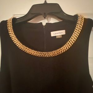 Calvin Klein black dress with gold chain neckline
